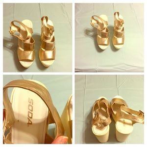 Gold platform shoes.